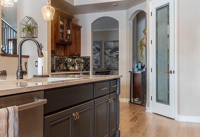 Custom carpentry kitchen with arched doorways